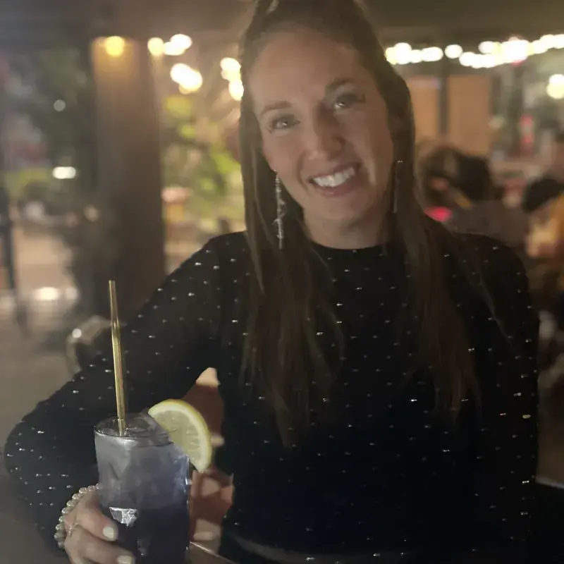 A guest raising a cocktail